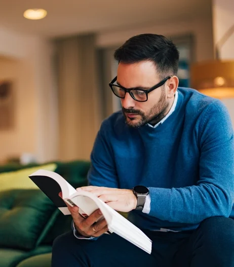 man in glasses reading