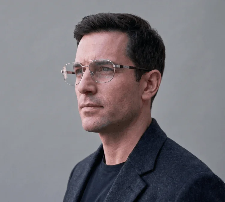 Person with cool skin tone wearing silver frames