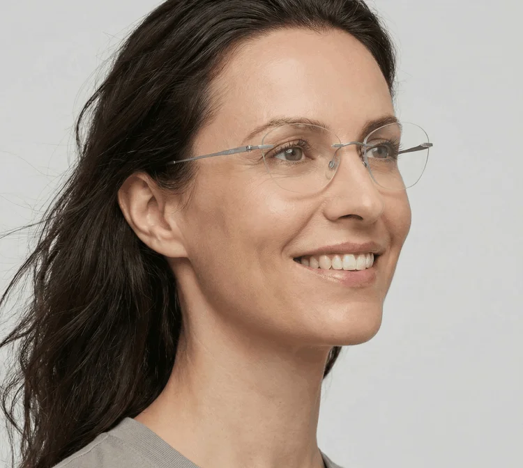 Person with neutral skin tone wearing silver frames