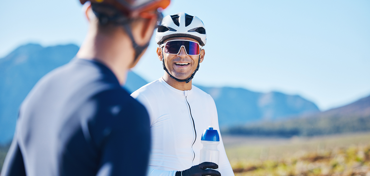 man cycling with glasses