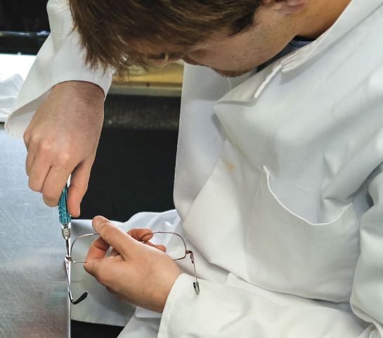 Lab technician assembling a pair of glasses