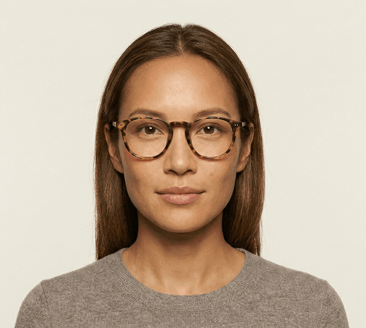 Person with warm skin tone wearing tortoiseshell frames