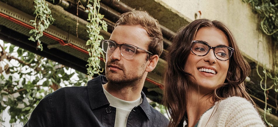 couple wearing designer glasses