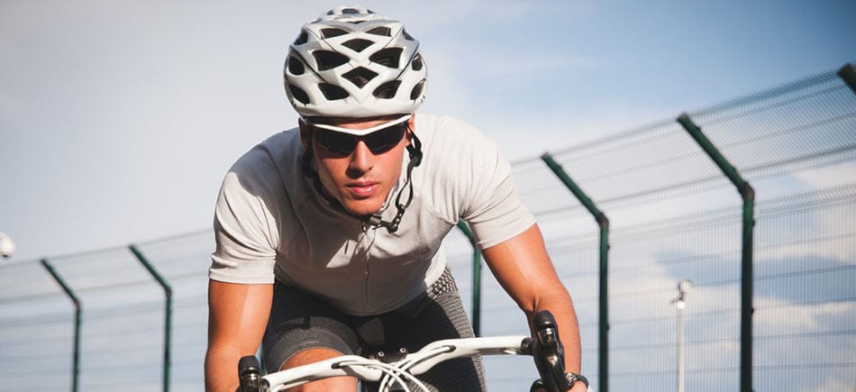 man cycling with glasses