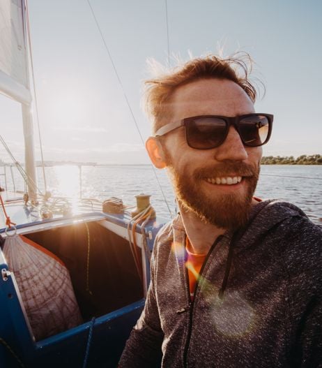 man on boat wearing sunglasses with polarised lenses