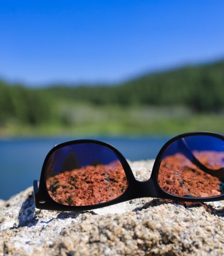 polarised sunglasses on rock