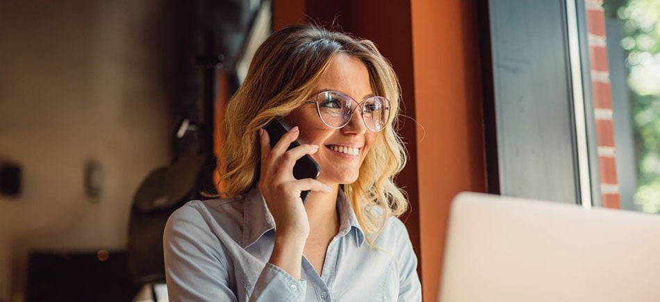 woman on the phone wearing glasses