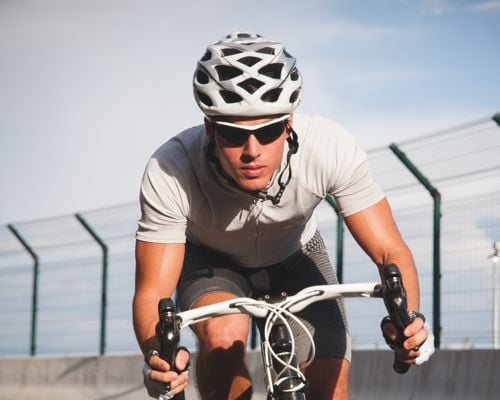 link to sports page with man on bike in sports glasses